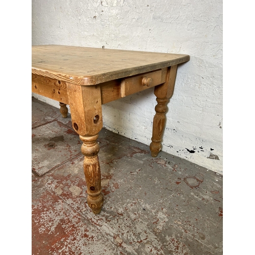 26 - A Victorian style pine rectangular farmhouse dining table with single drawer - approx. 76cm high x 8... 