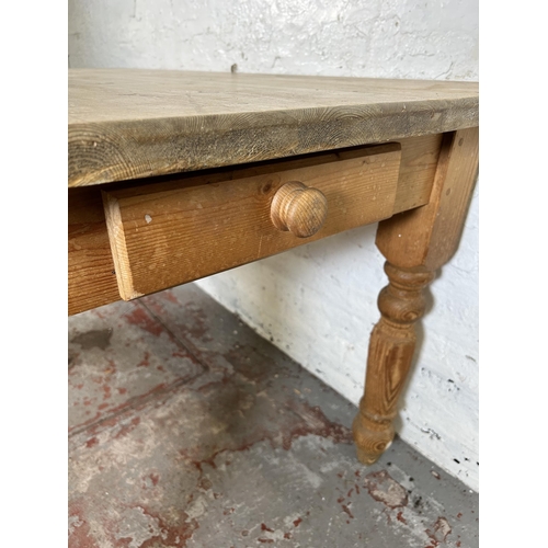 26 - A Victorian style pine rectangular farmhouse dining table with single drawer - approx. 76cm high x 8... 