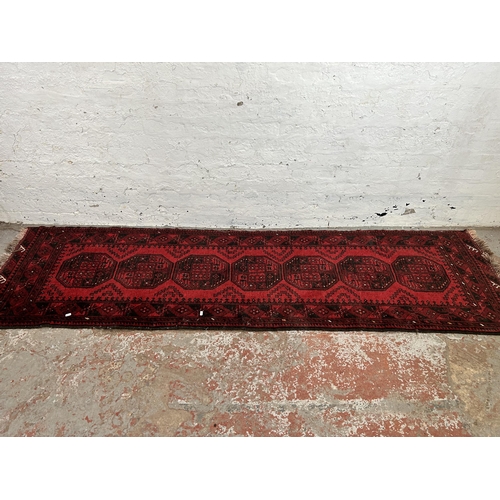 27 - A mid 20th century hand knotted hall runner - approx. 275cm long x 80cm wide