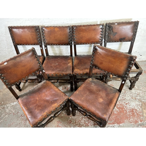 34 - A set of six Cromwellian style oak and brown leather dining chairs