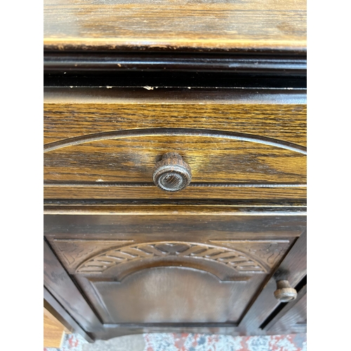 37 - An oak sideboard with two drawers and two cupboard doors - approx. 82cm high x 92cm wide x 40cm deep