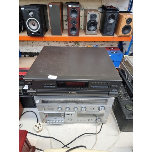 518 - Two items of hi-fi one Technics SL-PD687 five-disc changer CD player and one Philips F1218/35 music ... 