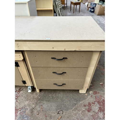 41 - A pine and MDF work bench with three drawers and matching cabinet on castors - approx. 90cm high x 1... 