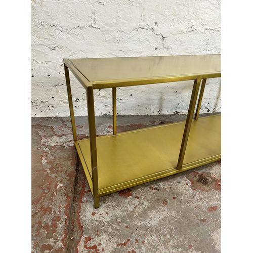 43A - A modern gilt metal rectangular two tier side table - approx. 35cm high x 90cm wide x 32cm deep