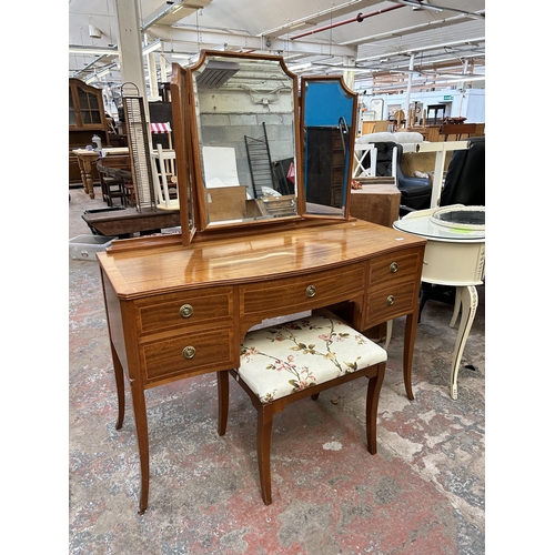 54 - A Regency style inlaid satinwood dressing table with upper three section mirror and five drawers - a... 
