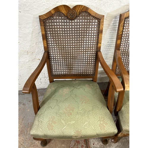 63 - A set of four walnut and rattan bergere armchairs with green floral upholstery