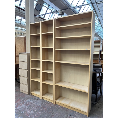 69 - Five pieces of modern furniture, three maple effect bookcases - largest approx. 202.5cm high x 80cm ... 