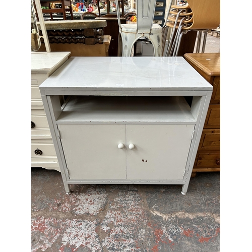 118 - A late 20th century white painted two door cabinet - approx. 77cm high x 81cm wide x 61cm deep