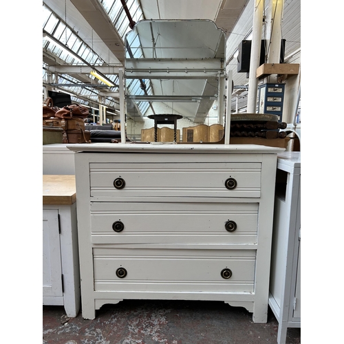 119 - An early 20th century white painted dressing chest with three drawers and upper mirror