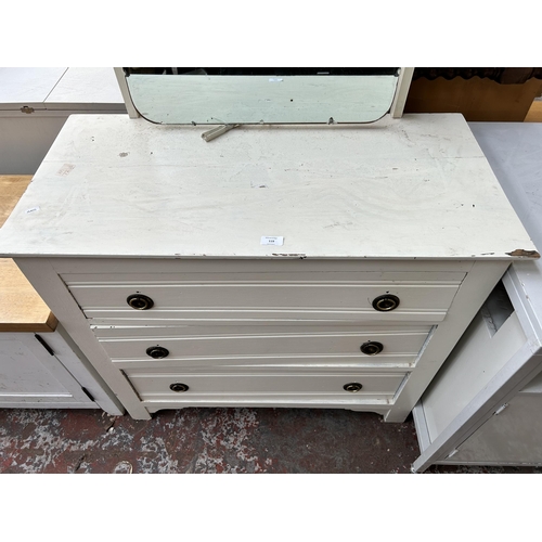 119 - An early 20th century white painted dressing chest with three drawers and upper mirror