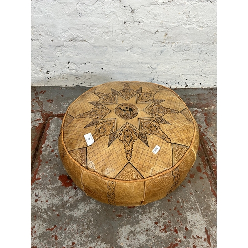 133 - A mid 20th century Moroccan leather footstool with camel design