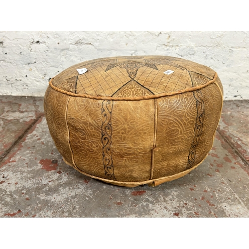 133 - A mid 20th century Moroccan leather footstool with camel design