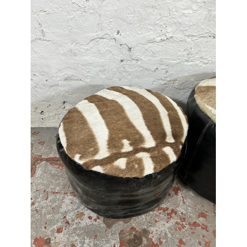 135 - Two mid 20th century Zebra skin and leather footstools