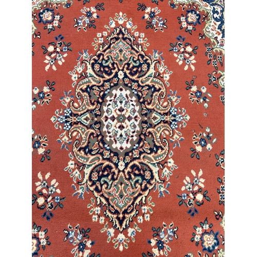 137B - A Persian style rug - approx. 225cm x 160cm