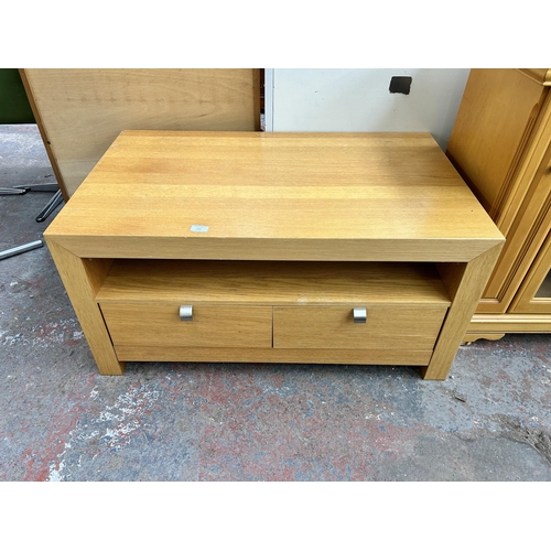 143 - A modern oak effect TV stand with two drawers - approx. 50cm high x 100cm wide x 60cm deep