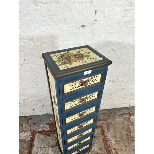 146 - A hand painted wooden chest of seven drawers with floral design - approx. 96cm high x 28cm wide x 22... 