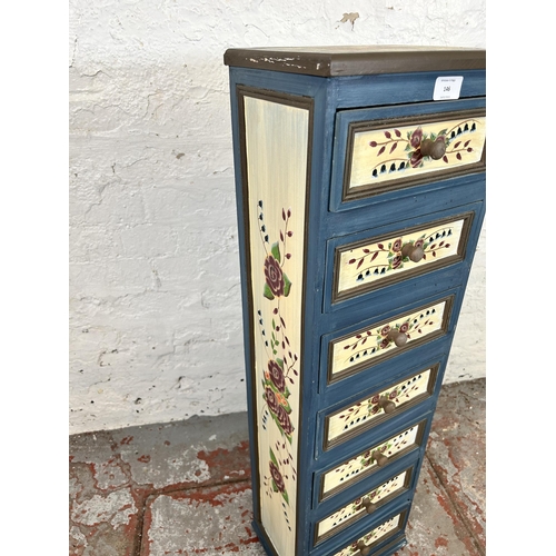 146 - A hand painted wooden chest of seven drawers with floral design - approx. 96cm high x 28cm wide x 22... 