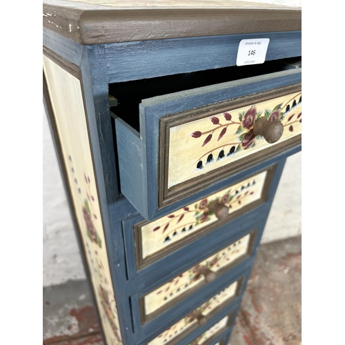 146 - A hand painted wooden chest of seven drawers with floral design - approx. 96cm high x 28cm wide x 22... 