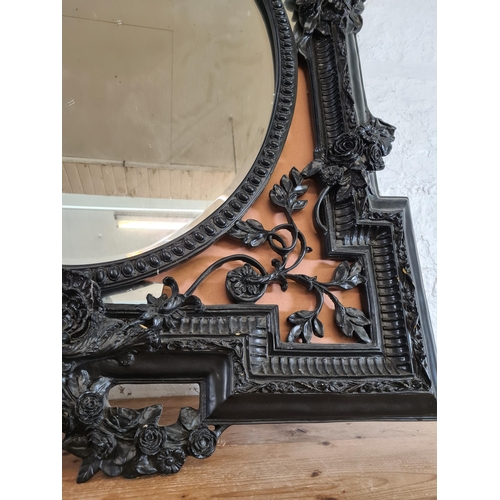 170 - A Victorian style black framed bevelled wall mirror - approx. 140cm high x 101cm wide