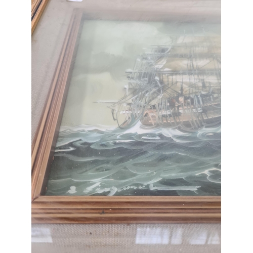 182 - A framed oil on canvas of a sailing ship signed lower left - approx. 42cm high x 52cm wide