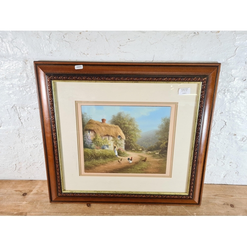 195A - A framed Raymond Gilronan oil painting of a cottage scene - approx. 54cm high x 60cm wide