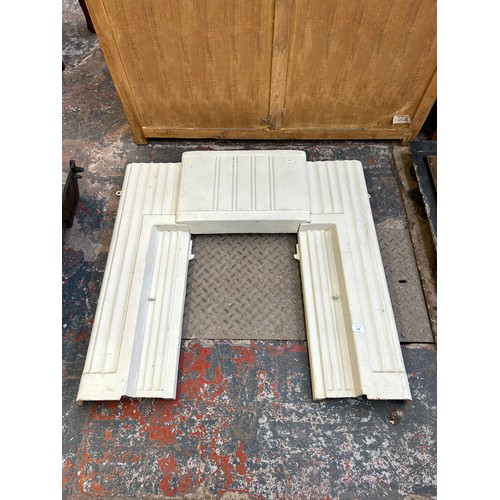 168 - An Art Deco white painted cast iron fire surround - approx. 92cm high x 96cm wide