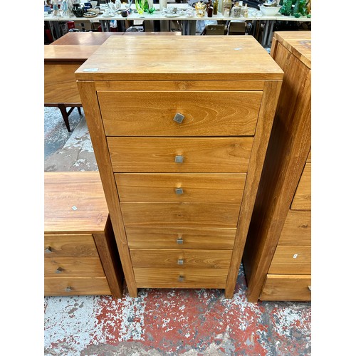 165 - A modern teak chest of seven drawers - approx. 119cm high x 55cm wide x 45cm deep