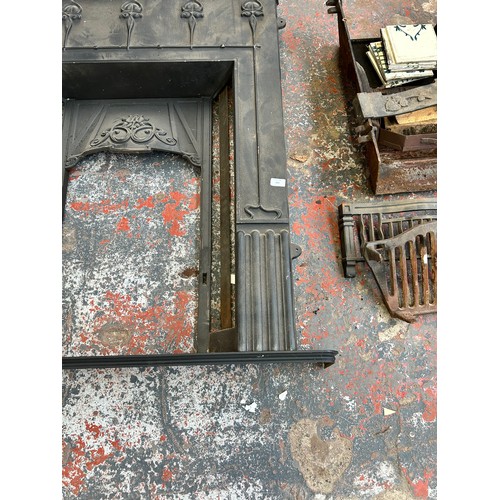 169 - An Art Nouveau style Gallery Collection Liberty cast iron fireplace - approx. 119cm high x 106cm wid... 
