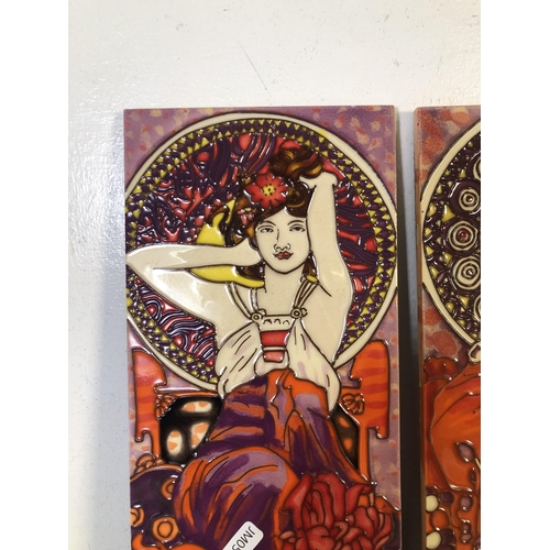 249 - Two Alphonse Mucha style tube-lined ceramic wall plaques - approx. 40cm high x 15cm wide