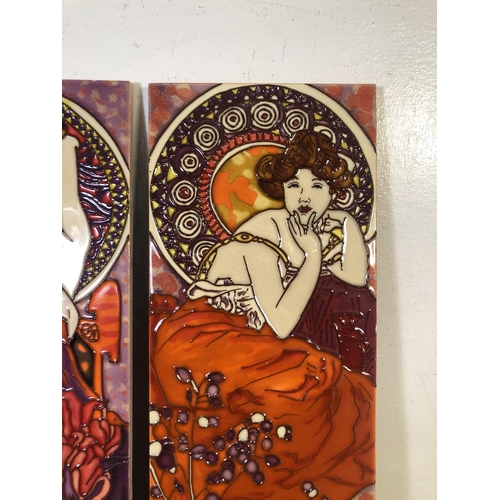 249 - Two Alphonse Mucha style tube-lined ceramic wall plaques - approx. 40cm high x 15cm wide