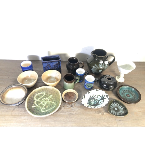 251 - A collection of mid 20th century studio pottery to include John Webb for Lostwithiel Pottery slipwar... 