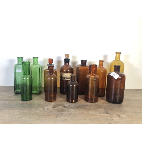 259 - Twelve vintage glass apothecary bottles - largest approx. 24cm high