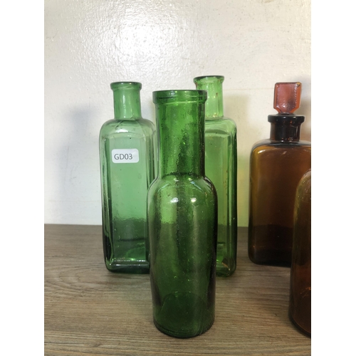 259 - Twelve vintage glass apothecary bottles - largest approx. 24cm high