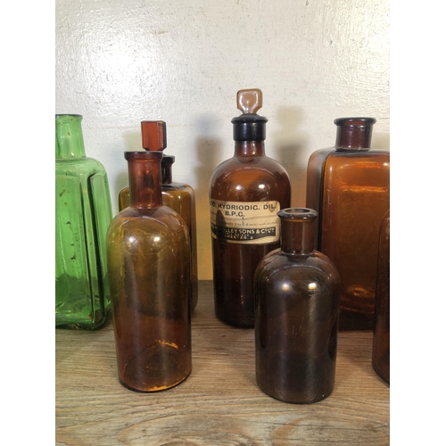 259 - Twelve vintage glass apothecary bottles - largest approx. 24cm high