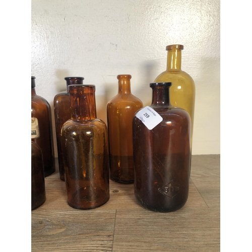 259 - Twelve vintage glass apothecary bottles - largest approx. 24cm high