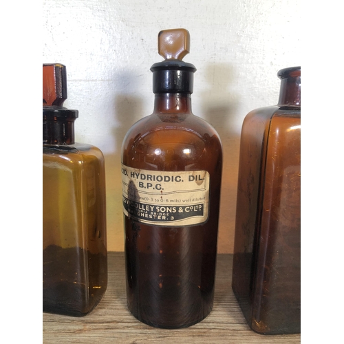 259 - Twelve vintage glass apothecary bottles - largest approx. 24cm high