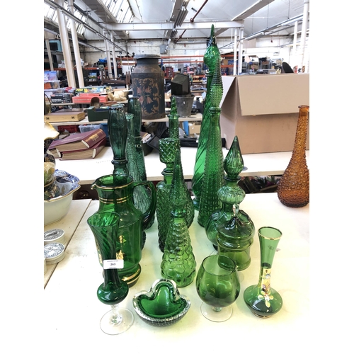 263 - Sixteen pieces of mid 20th century green glassware to include genie bottles, ashtray etc.