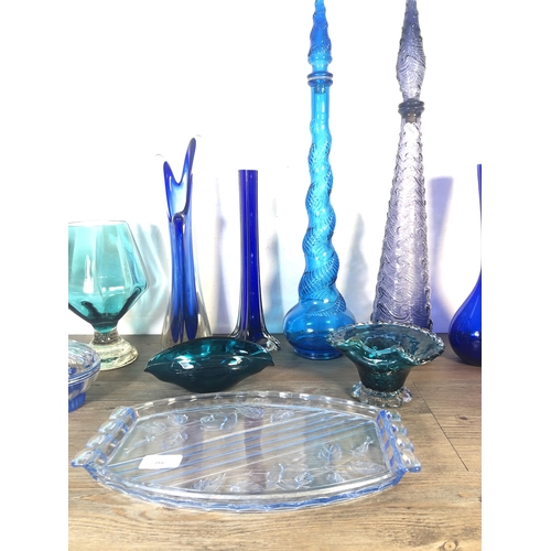 266 - Eleven pieces of mid 20th century blue glassware to include two genie bottles, Art Deco style lidded... 