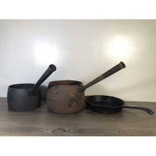 289 - Three pieces of cast iron kitchenware, two saucepans and one frying pan