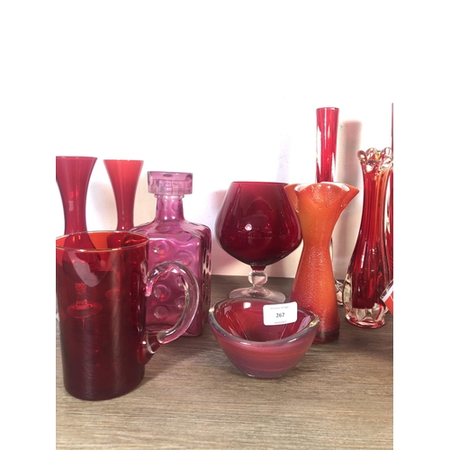 267 - Fourteen pieces of mid 20th century red glassware