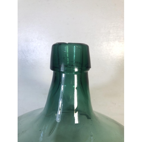 270 - A vintage green glass demijohn - approx. 45cm high