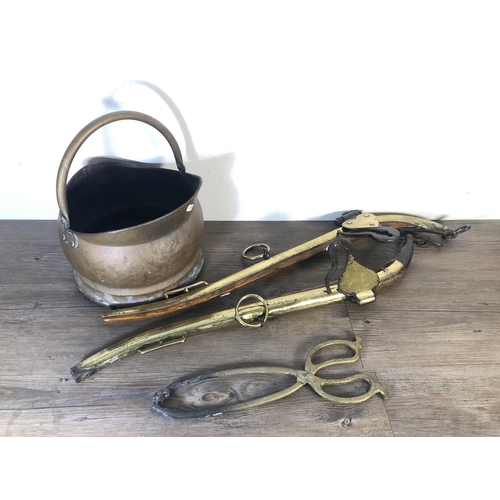 294 - Four pieces of Victorian brassware, two oak and brass horse hames, one coal scuttle and one pair of ... 