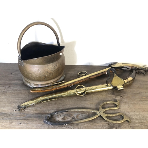 294 - Four pieces of Victorian brassware, two oak and brass horse hames, one coal scuttle and one pair of ... 