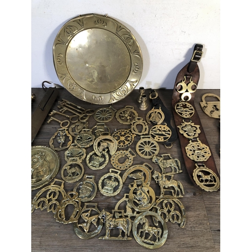 295 - A collection of brassware to include Joseph Sankey & Sons charger, horse brasses etc.