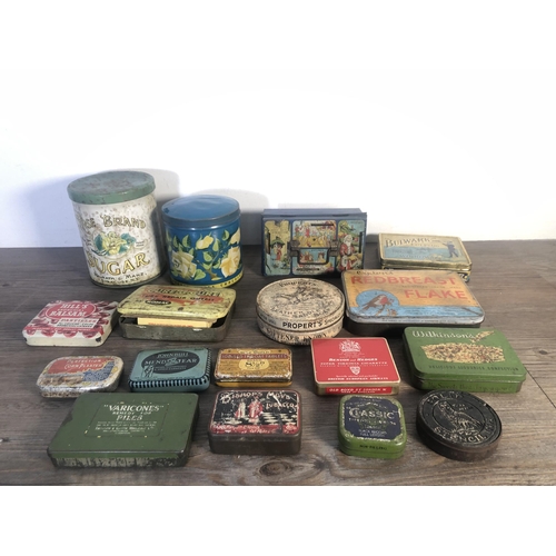 303A - A collection of vintage advertising tins