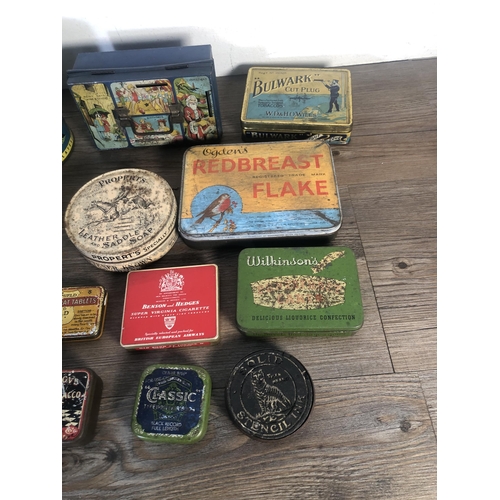 303A - A collection of vintage advertising tins