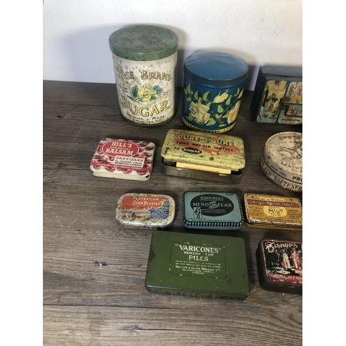 303A - A collection of vintage advertising tins