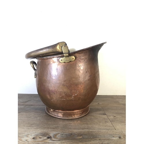 283 - A Victorian copper helmet coal scuttle - approx. 36cm high