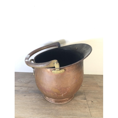 283 - A Victorian copper helmet coal scuttle - approx. 36cm high