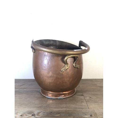 283 - A Victorian copper helmet coal scuttle - approx. 36cm high